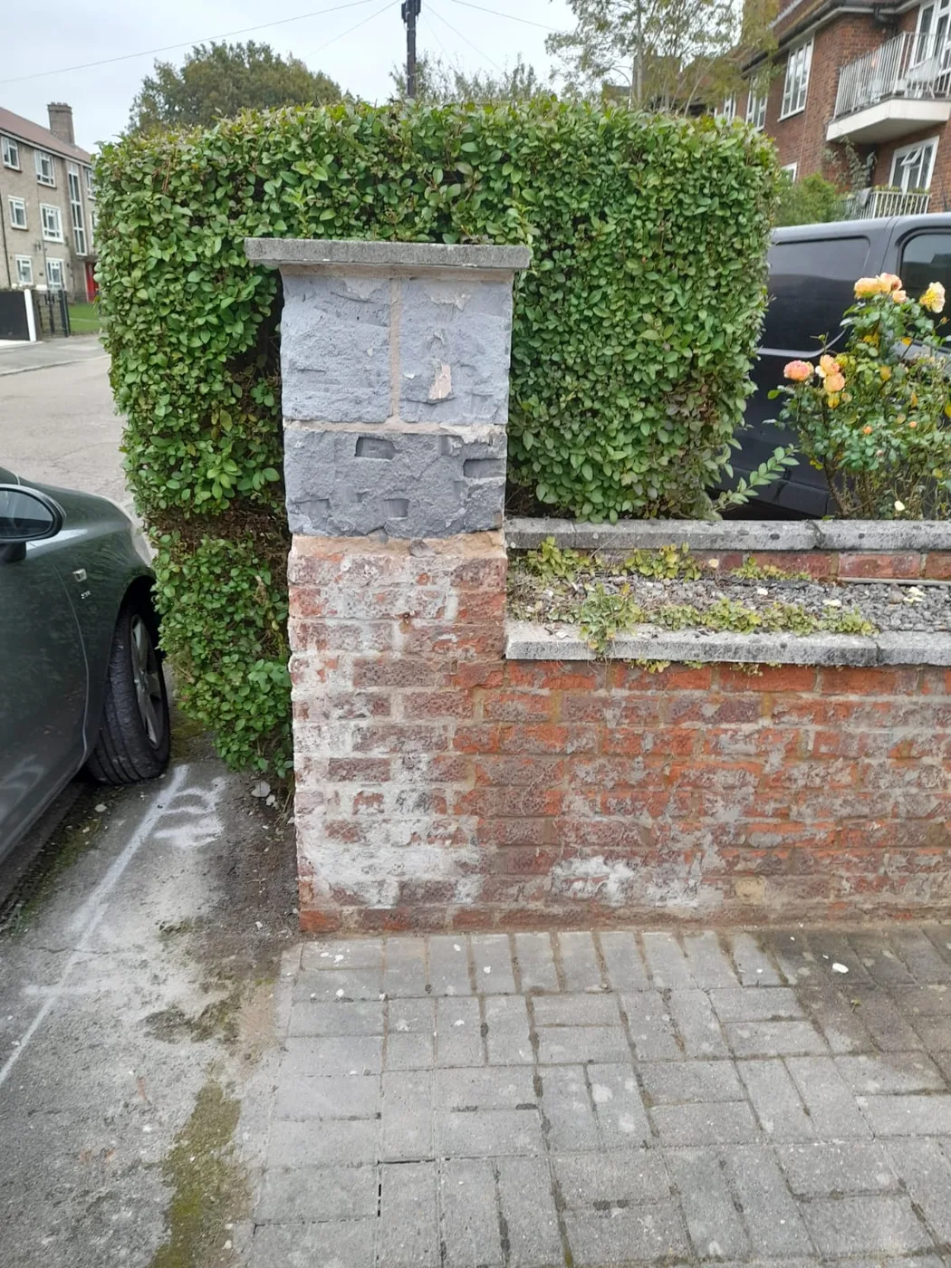 Original brick pillar and boundary wall